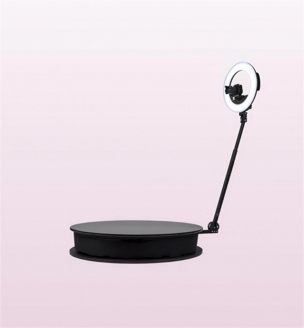 The 360 video booth platform with its rotating camera arm and ring light