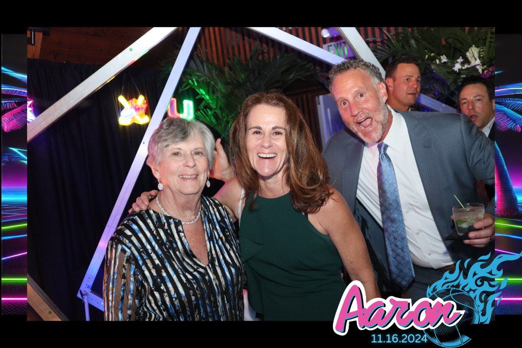 Guests at a celebration with a custom neon print overlay
