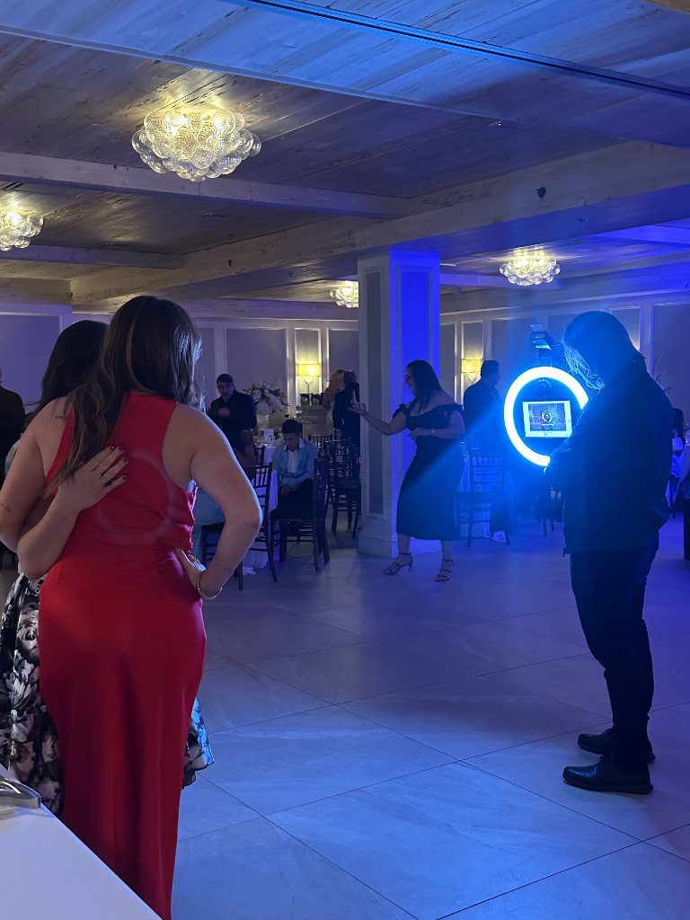 Roaming booth ring light moving through a ballroom reception