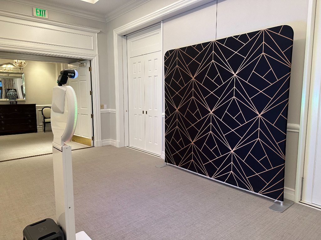 Booth setup with a geometric backdrop before guests arrive