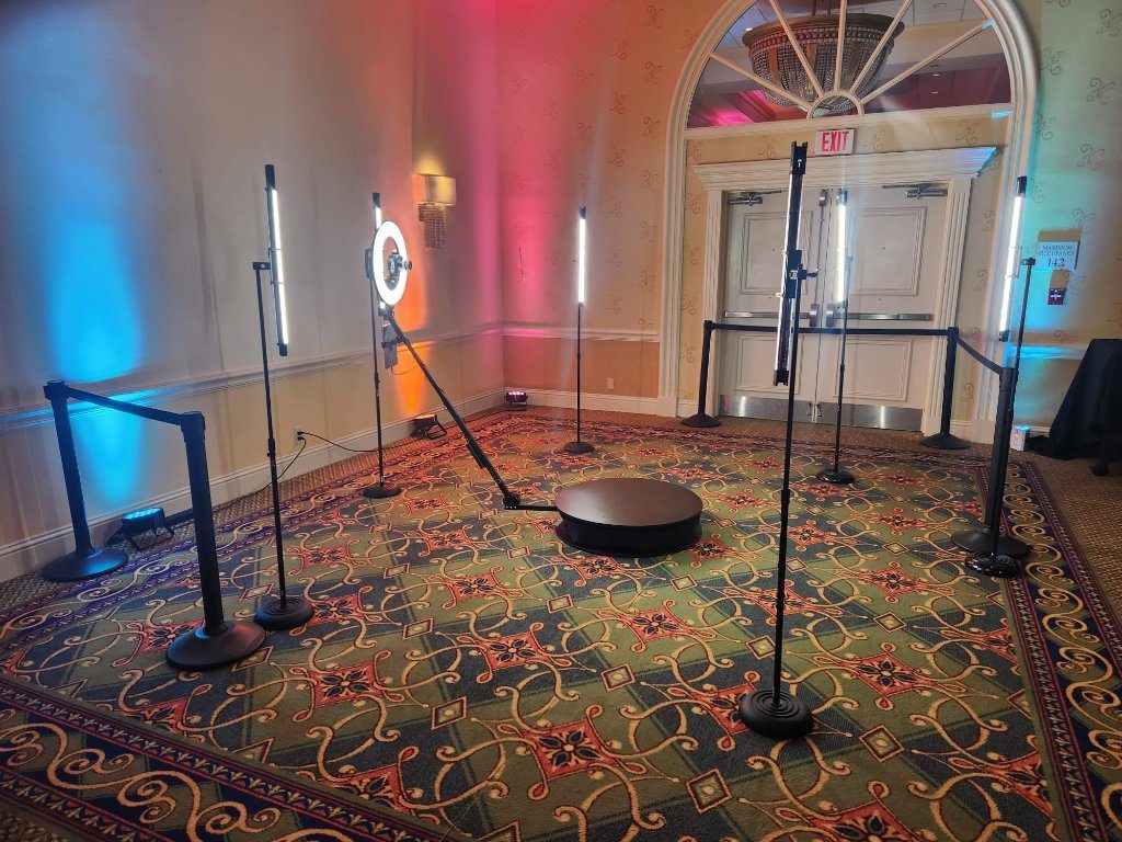 360 video booth platform staged in a ballroom with studio lighting