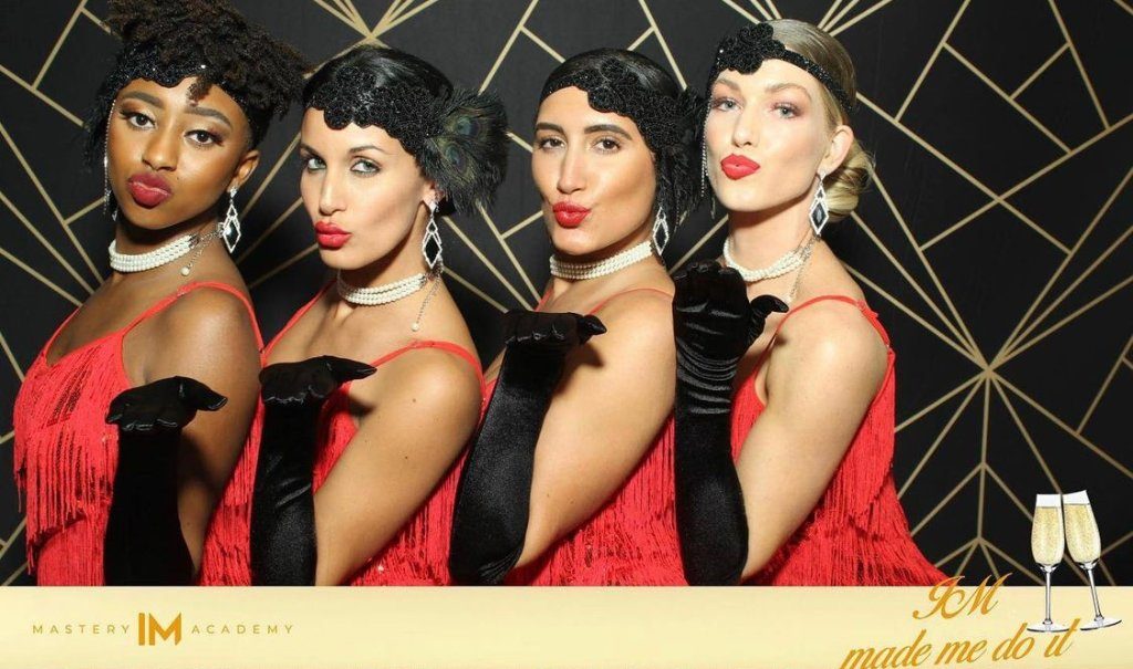 Guests in themed costume at a corporate gala booth